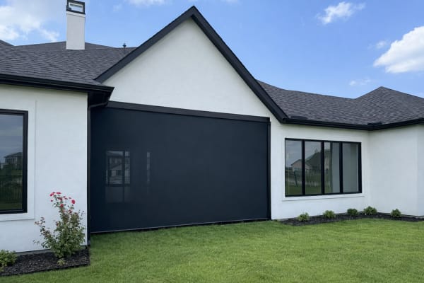 Solar shade screen protecting outdoor living area