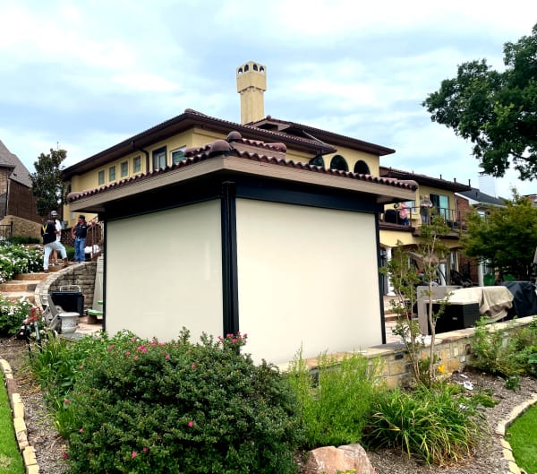 Pavilion with solar shade screens installed