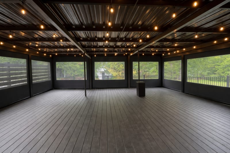 V-Track covered porch enclosure in Conroe, Texas