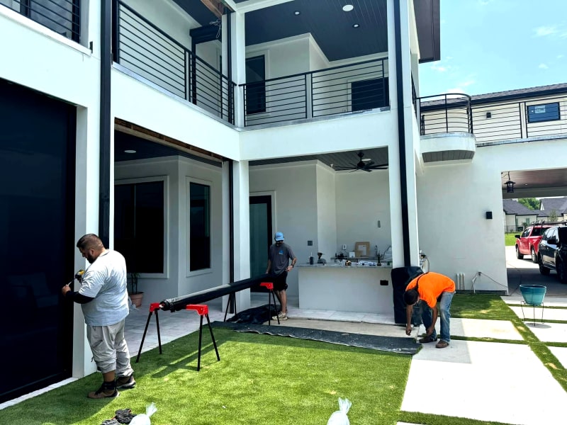 V-Track dealer installing motorized screen