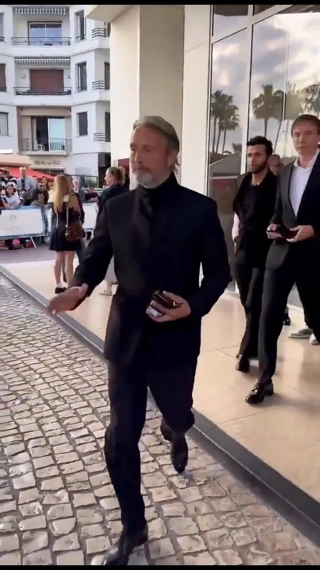 Mads Mikkelsen waving to fans