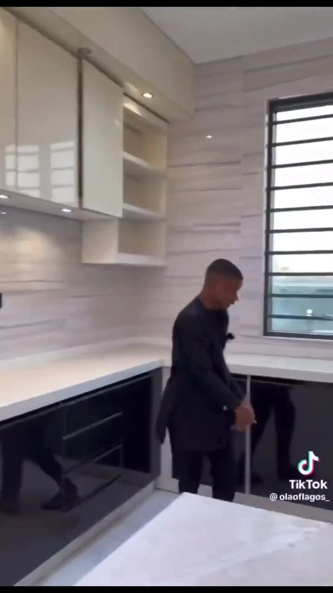 Lagos real estate agent enthusiastically showing house space