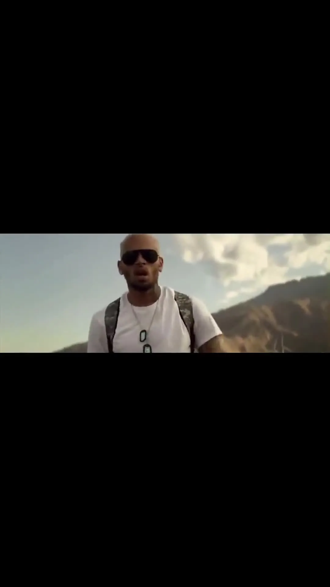 Chris Brown Walking Through Wind Turbines Alone