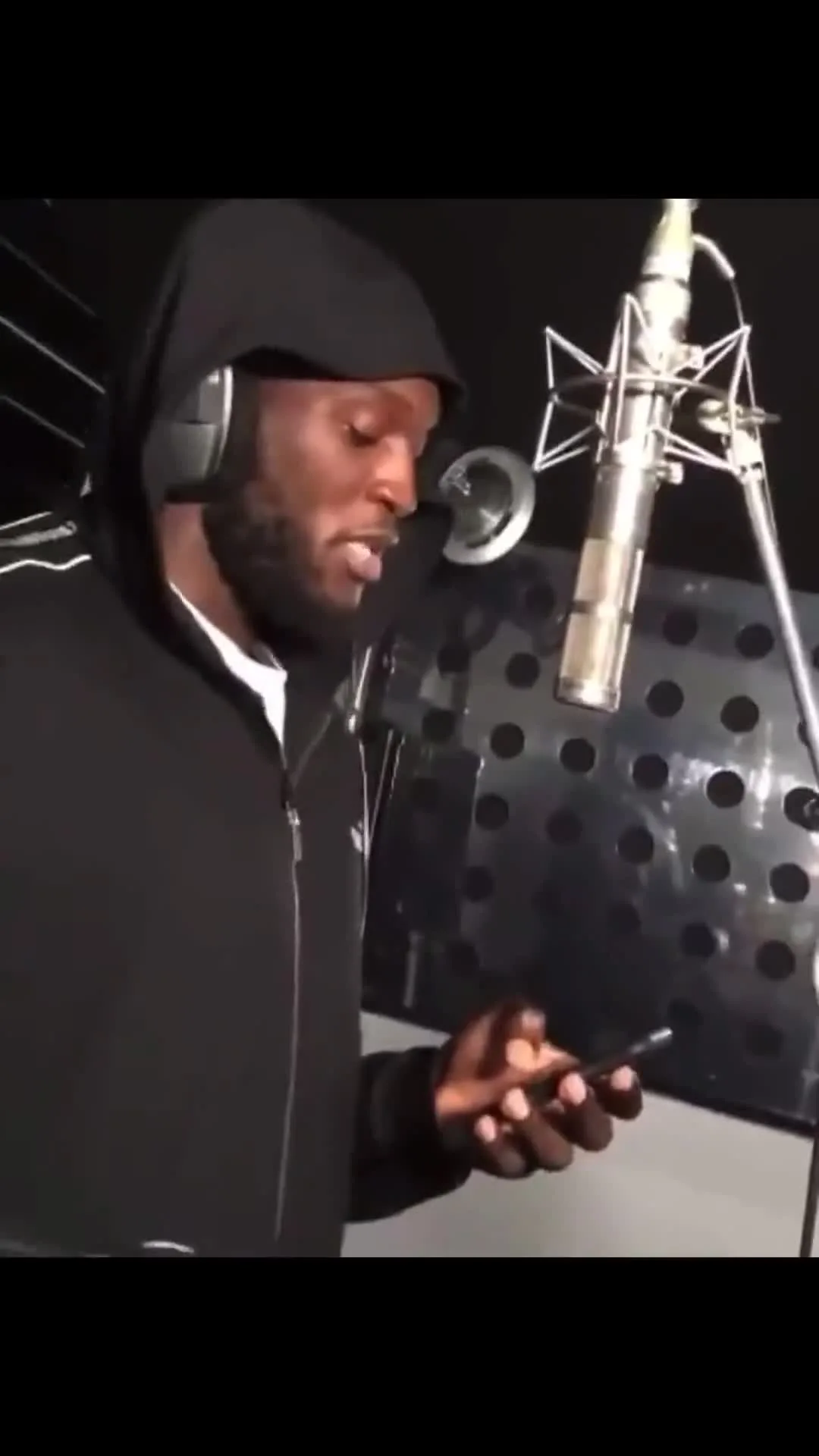 Lukaku Reading Bars From His Phone in Studio
