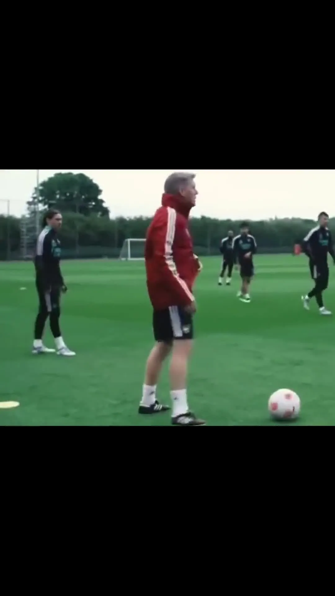 Coach Pointing Out Players at Training