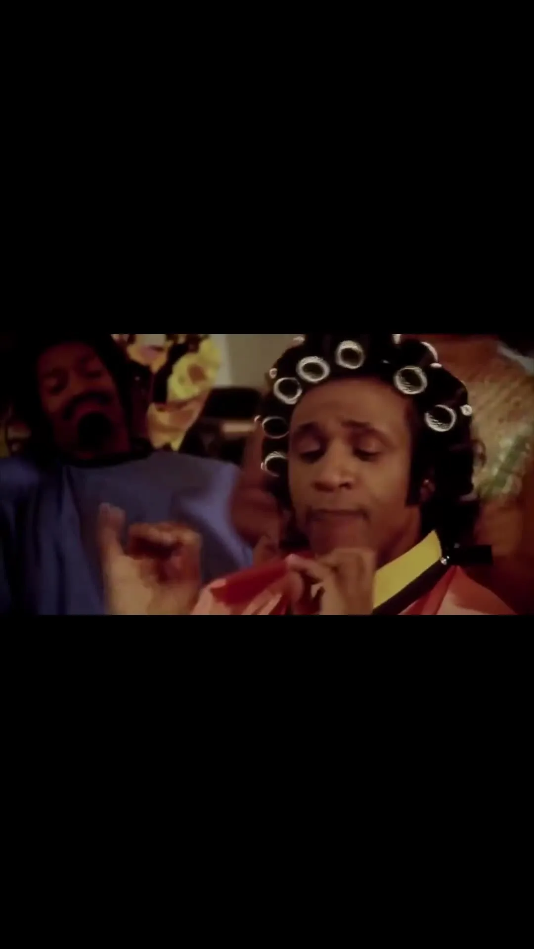 Cream Corn singing in hair salon with rollers