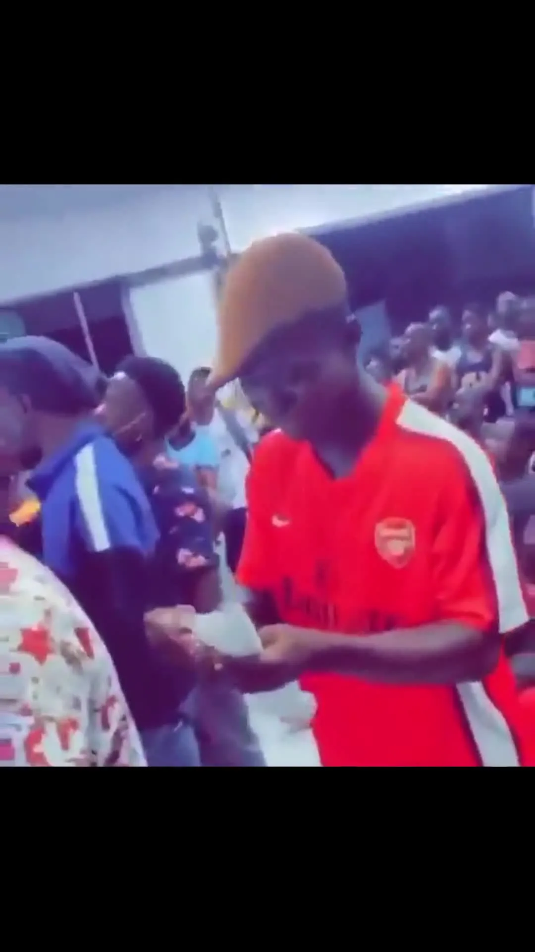 Guy Checks Betting Slips in Disbelief
