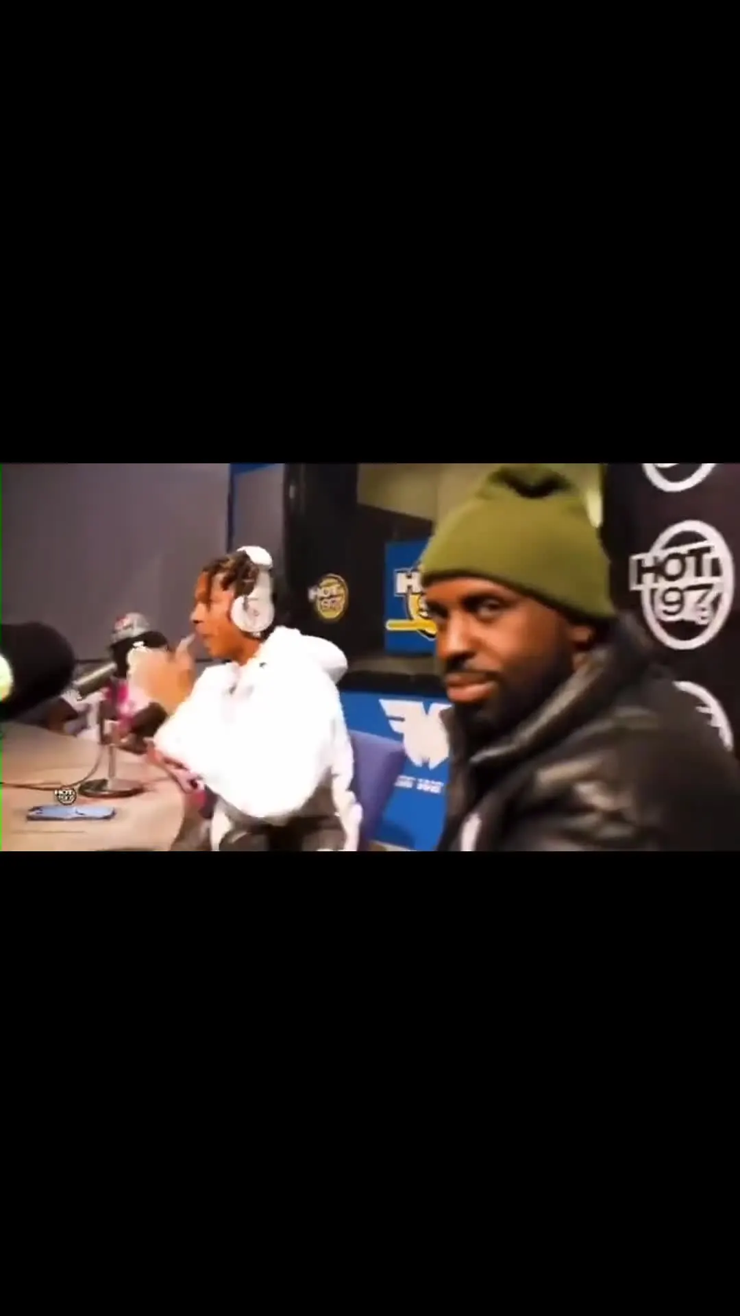 Funkmaster Flex Staring While Guest Talks