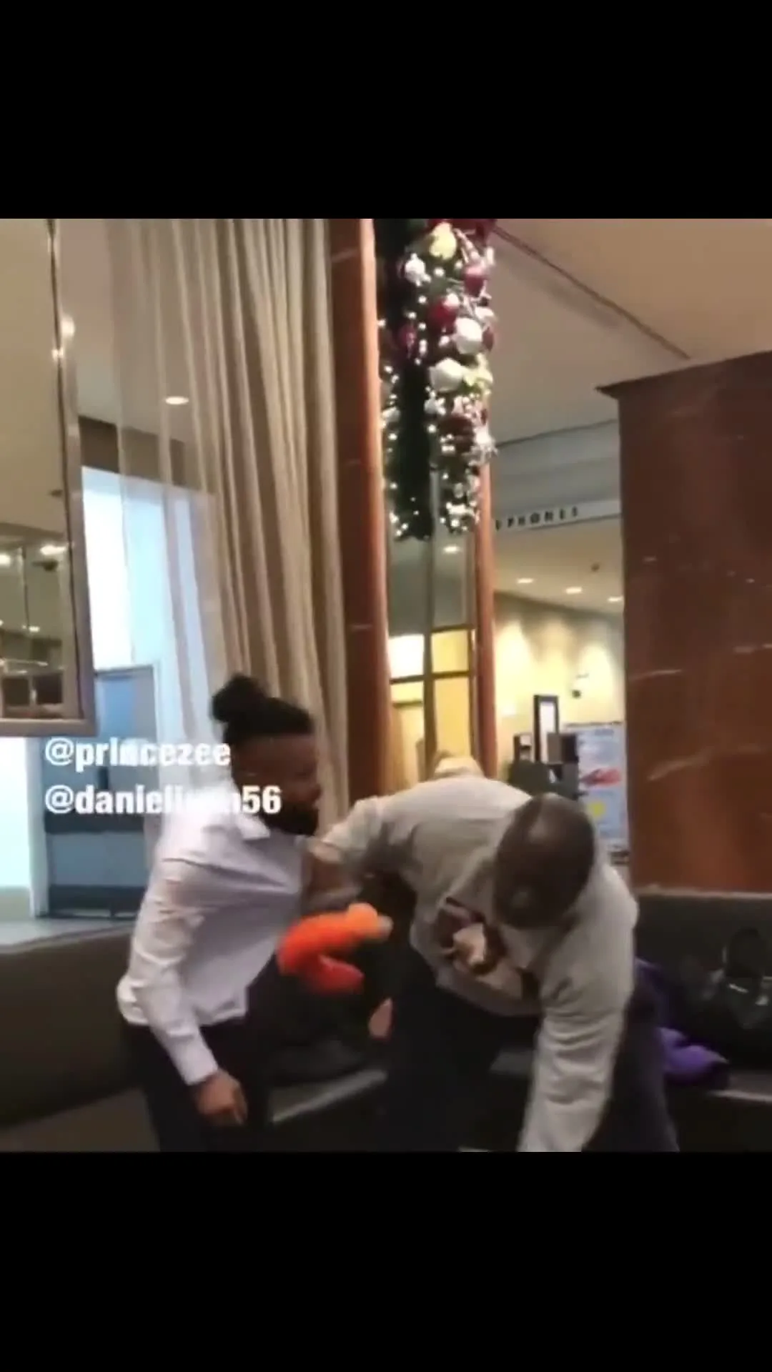 Big Guy Throws Man Into Suitcase Across Lobby