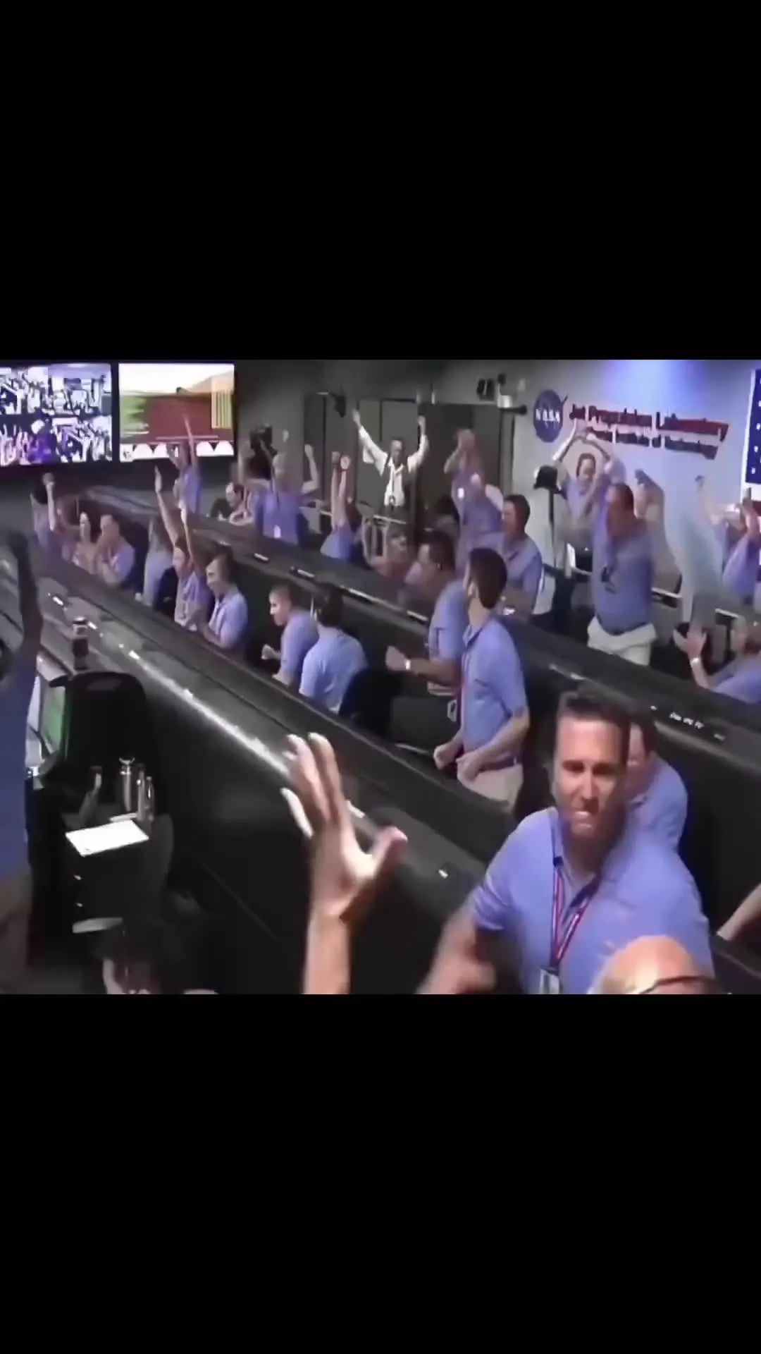 NASA space control room celebration