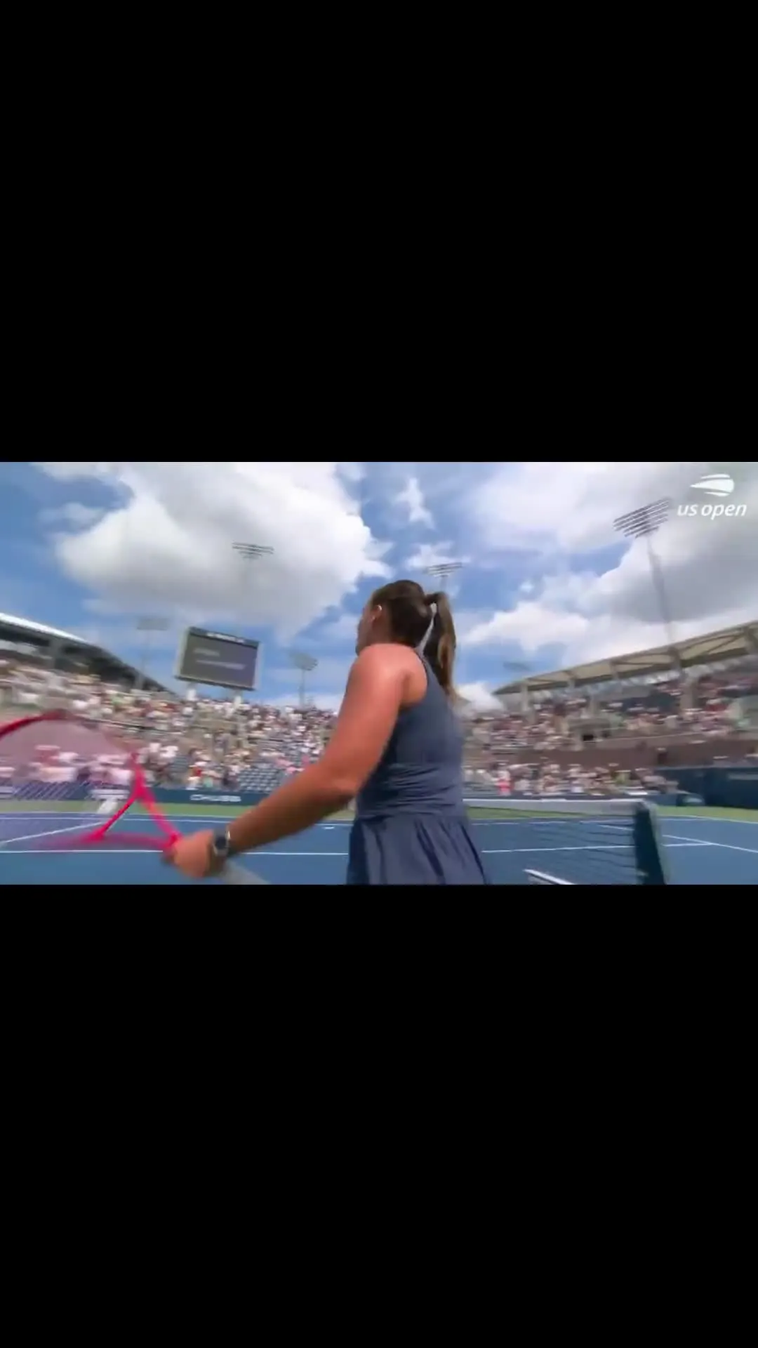 US Open woman smashing tennis racket