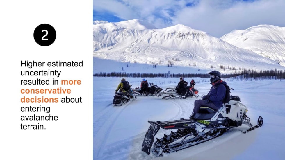 A slide from the presentation, showing snowmobilers crossing open snow.