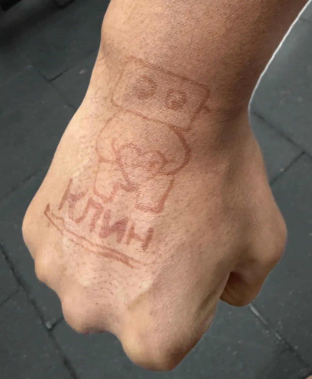 The Cline logo and КЛИН (Cline in Russian Cyrillic) hand drawn in henna