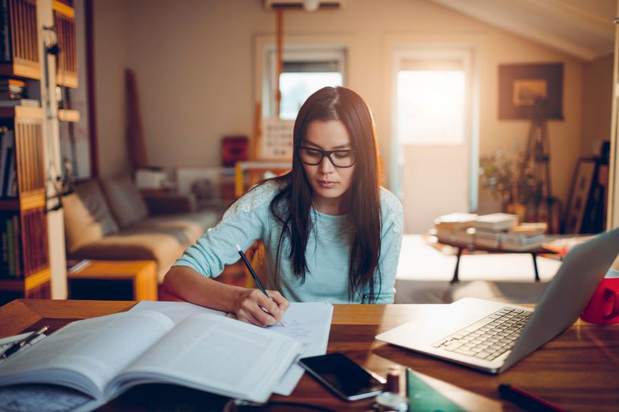 student studying for online course test