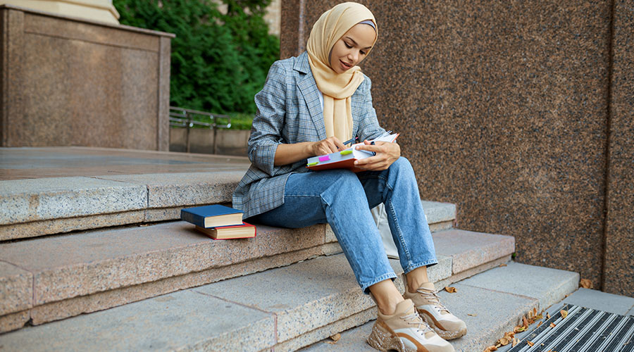 student-sitting-on-the-stairs-in-university