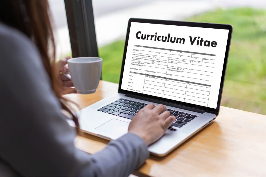student writing cv for their first job