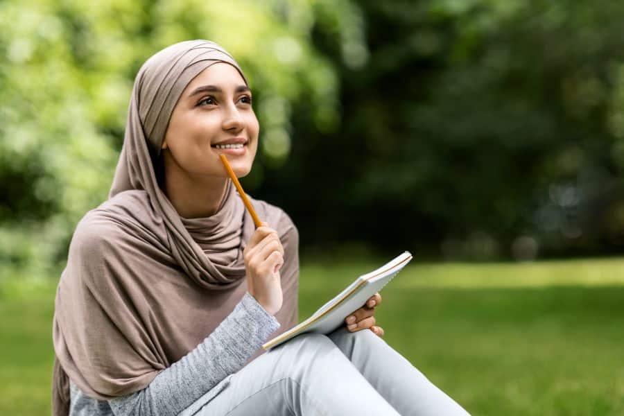 student sitting in positive study environment while studying for exams