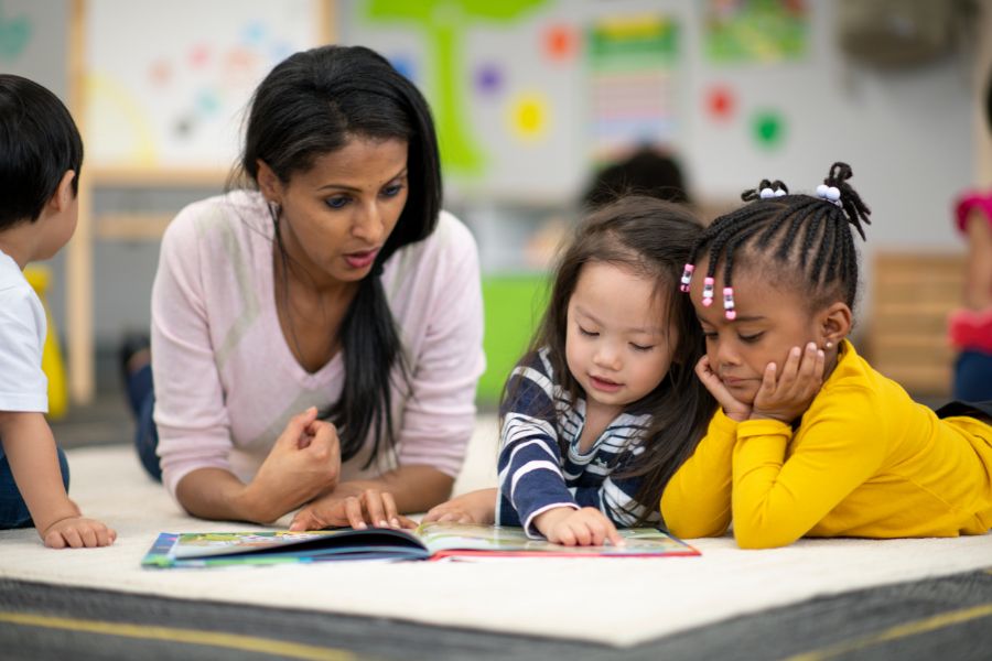 woman teaching learners after having completed a diploma in teaching