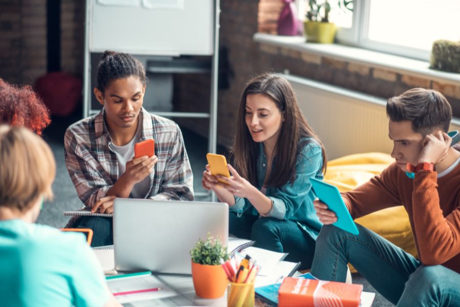 group of students using gadgets