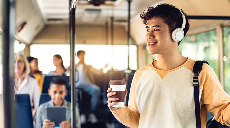 Smiling students on public transport