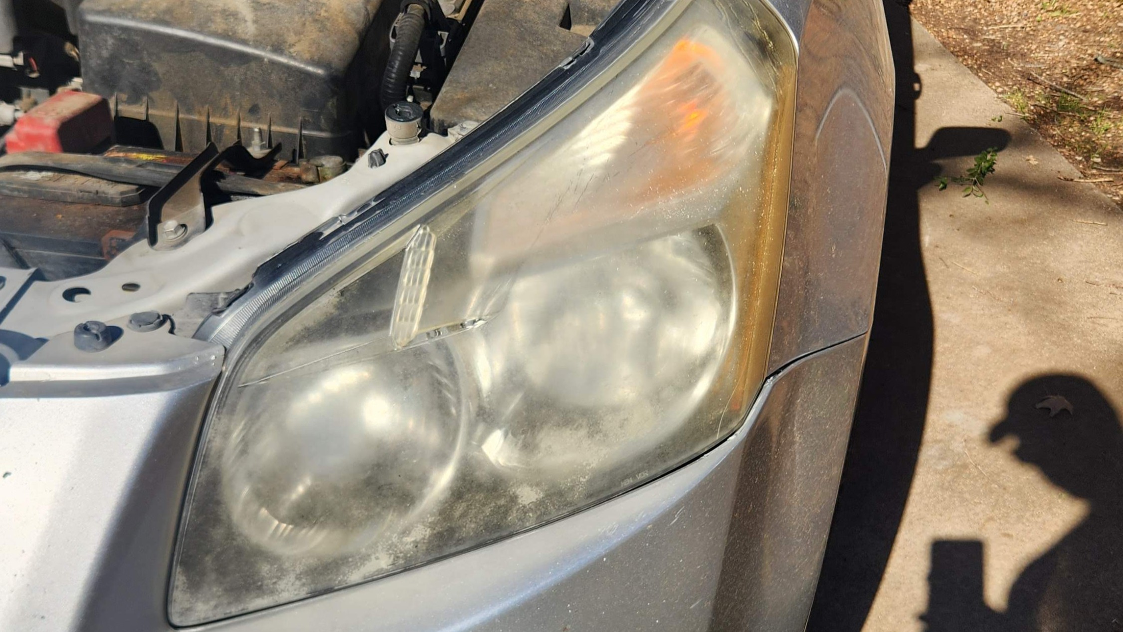 Yellow foggy oxidized headlight damaged by UV rays