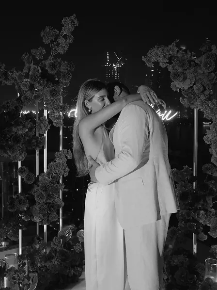 Evening proposal with red rose backdrop by Dubai content creator Candid With Jay