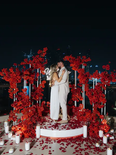 Engaged couple sharing a moment - captured during Dubai proposal shoot by Candid With Jay