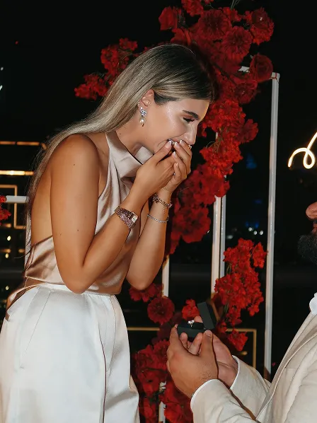 Engaged couple sharing a moment - captured during Dubai proposal shoot by Candid With Jay