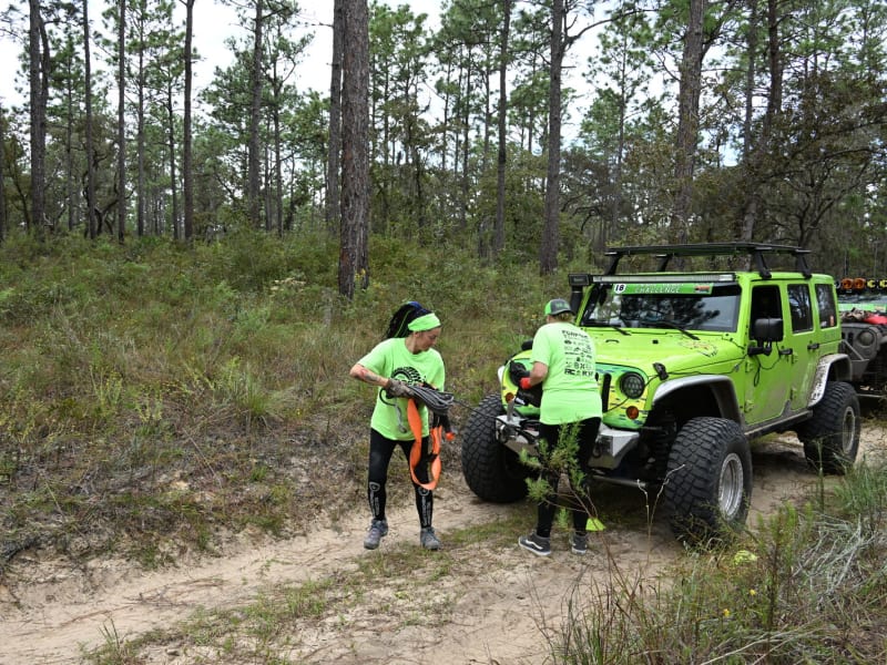 Group of rigs and teams at base between challenge sets