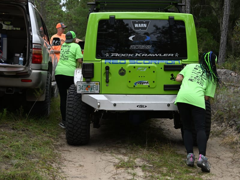 Team tackling a problem-solving station in the field