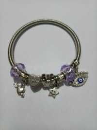 Charm Bracelet with Purple Beads and Silver Charms