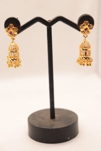 Gold Plated Filigree Jhumka Earrings with Ruby Stones