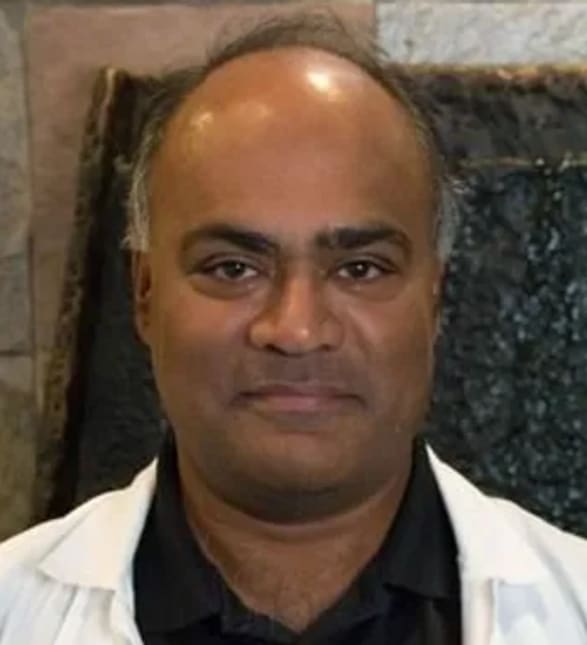 Dr. Schenley Poliah, Dentist in LifeSmiles Dental - Grant Park Mall - Portrait Photo