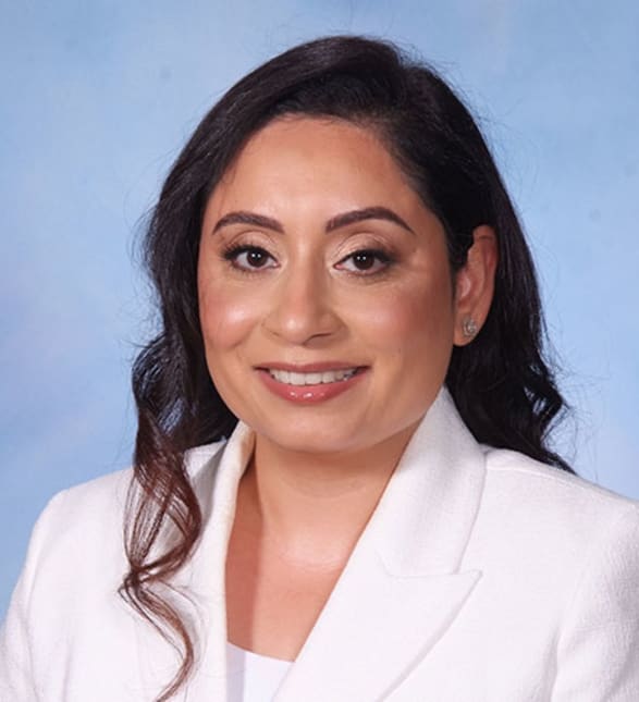 Dr. Gurpreet Bhatia, Dentist in Clayburn Dental - Portrait Photo