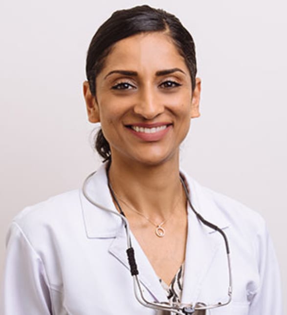Dr. Kiran Sahi, Dentist in Clayburn Dental - Portrait Photo