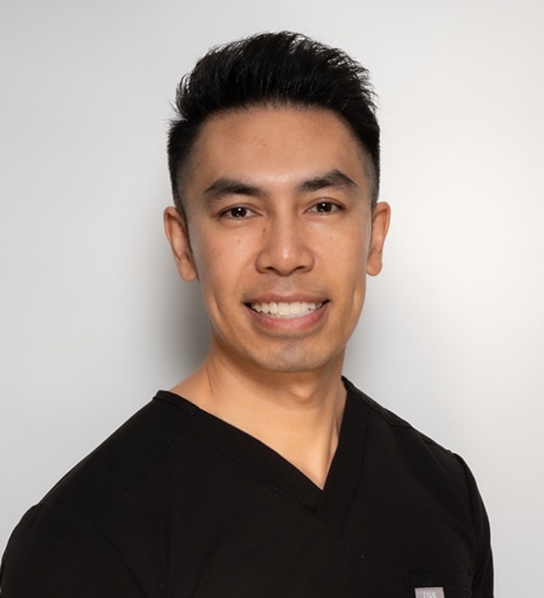 Dr. Herbert Woo, Dentist in Magrath Dental - Portrait Photo