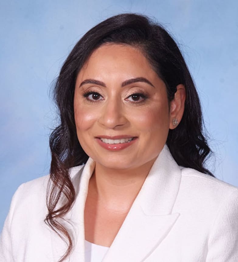 Dr. Gurpreet Bhatia, Dentist in Clayburn Dental - Portrait Photo