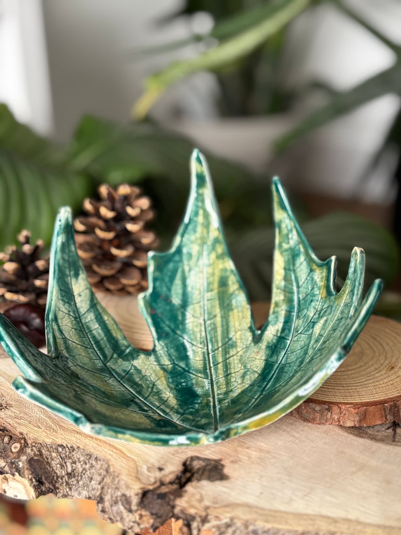 Turquoise glazed ceramic leaf-shaped dish with hand-carved vein details, approximately 18-20cm across