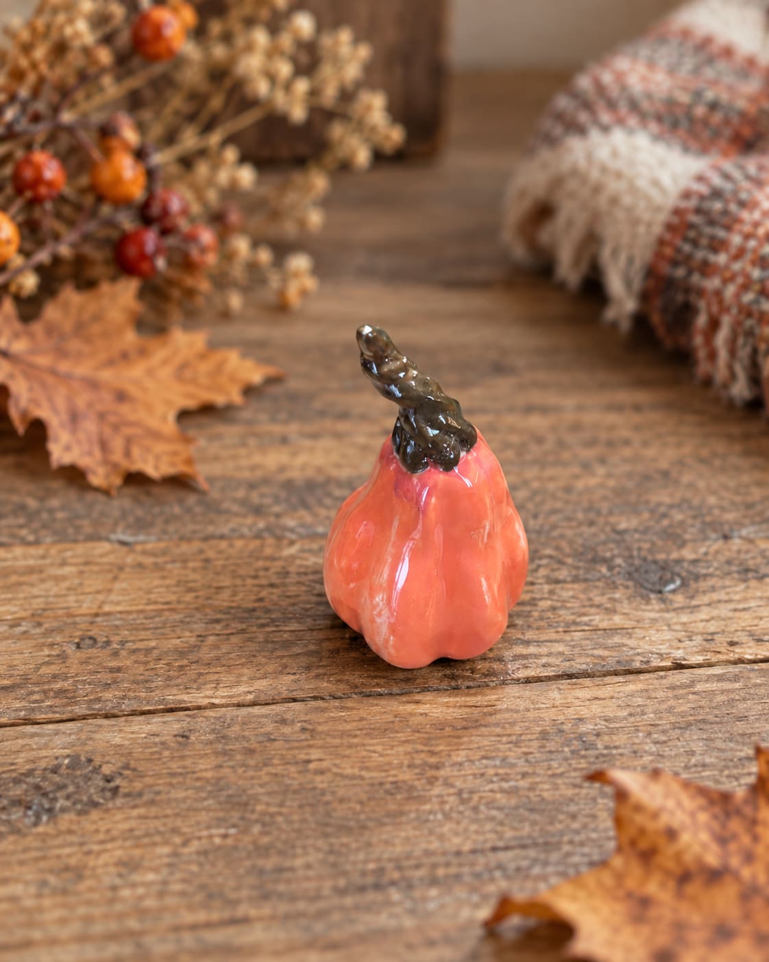 Handmade orange ceramic pumpkin, 10 x 8 cm. A unique autumn decoration for shelves, tables and cosy seasonal displays. Handmade by InchyArt.