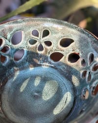 Close-up of the hand-cut floral details in the ceramic