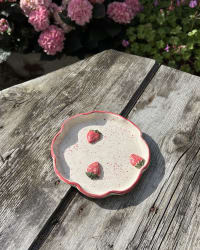 Dish styled on a vanity table with jewellery