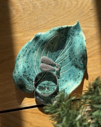 Turquoise ceramic leaf-shaped dish with hand-carved vein details and speckled glaze, botanical form