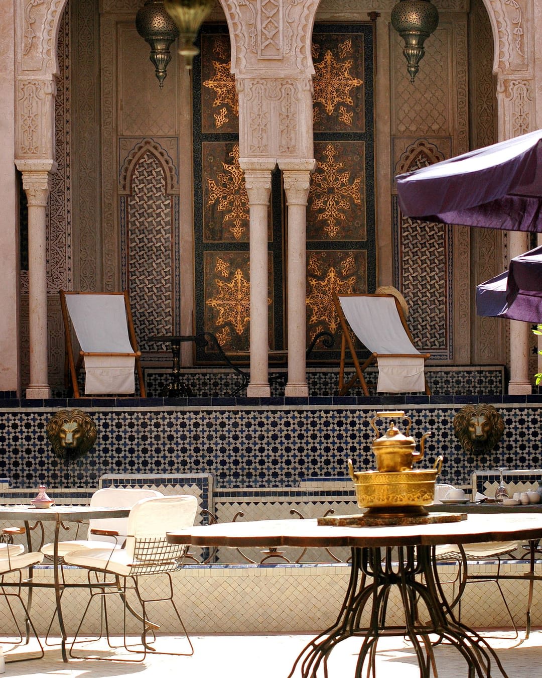 Carved stucco arches and zellige in a traditional Fes house