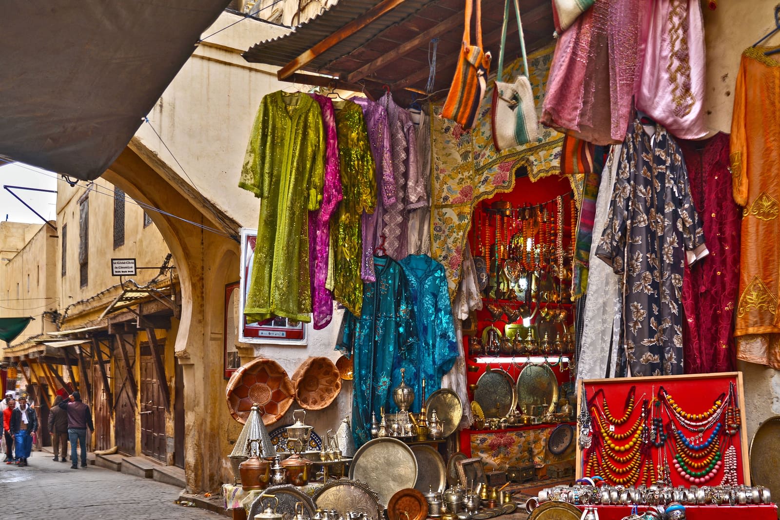 Fes craft shop with copperware, lanterns and colourful fabrics