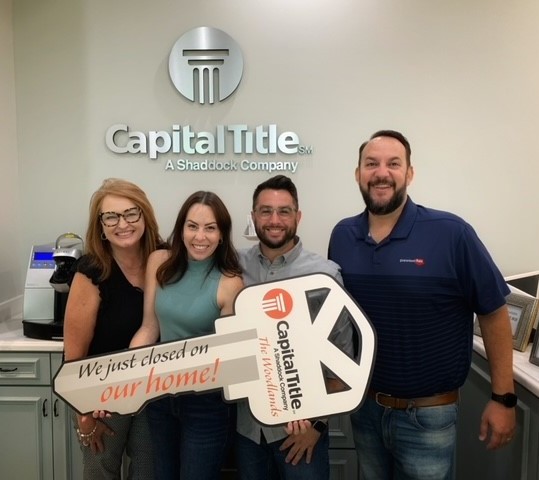 Michelle with happy clients after closing