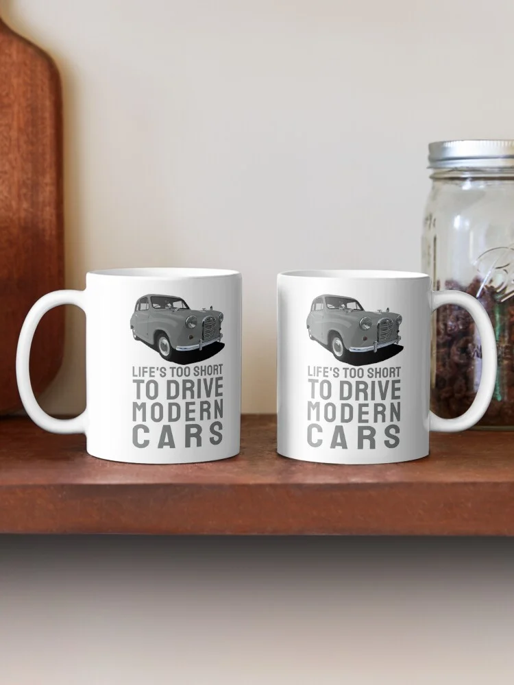 Two white mugs displaying a graphic of an Austin A35 and the text 'Life's too short to drive modern cars'.