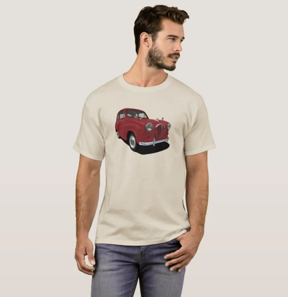 A man wearing a light beige t-shirt with a graphic of a red Austin A35 on the front.