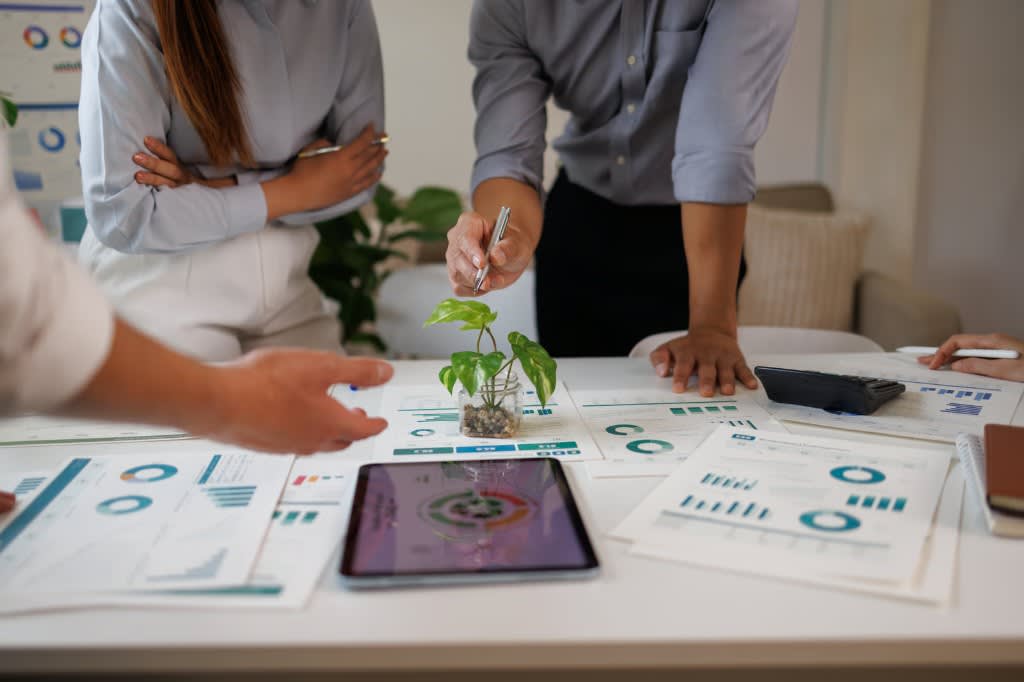 Teams reviewing ERP and CRM dashboards, reports, and operating metrics together