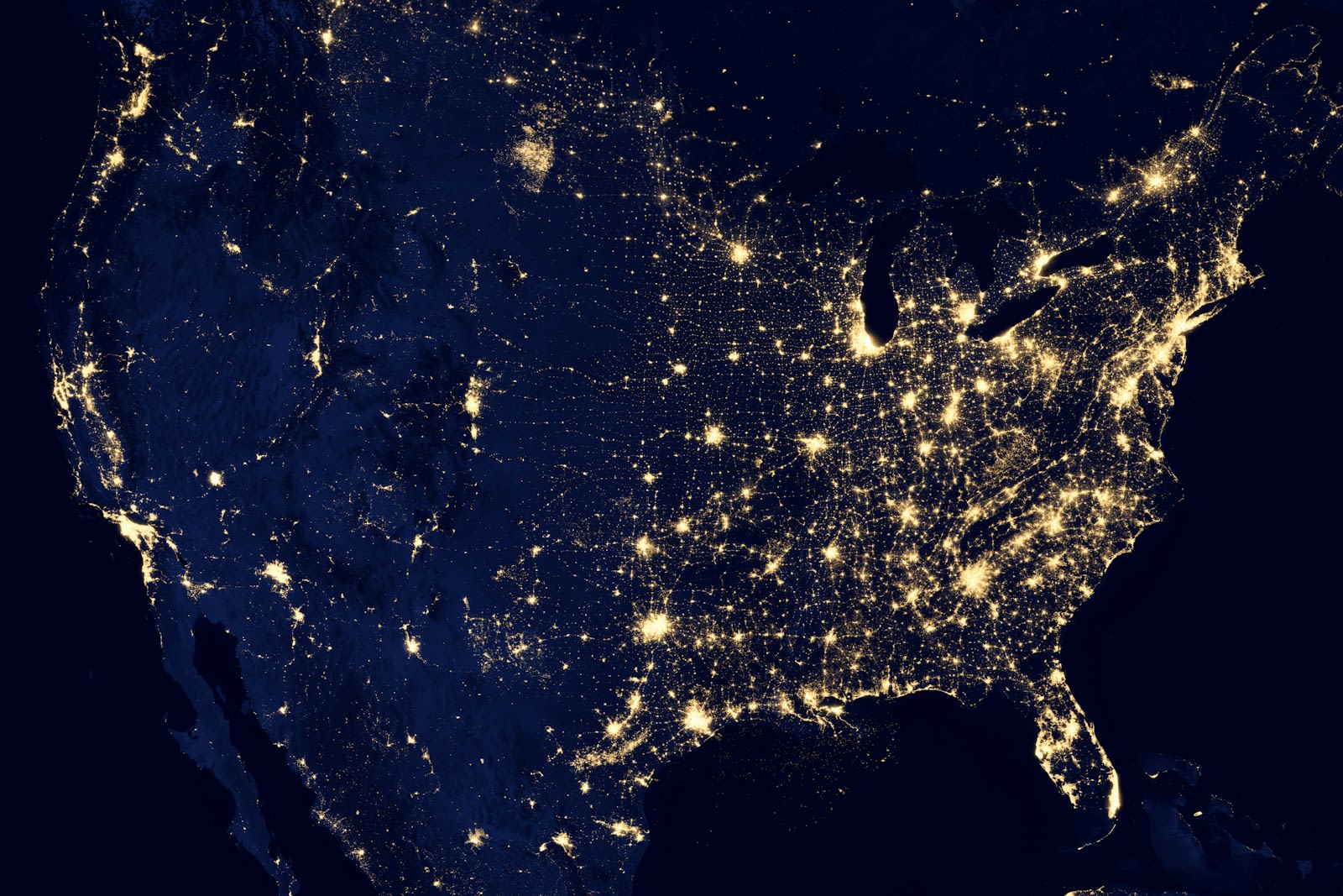 Satellite night view of Earth representing aerospace mission systems