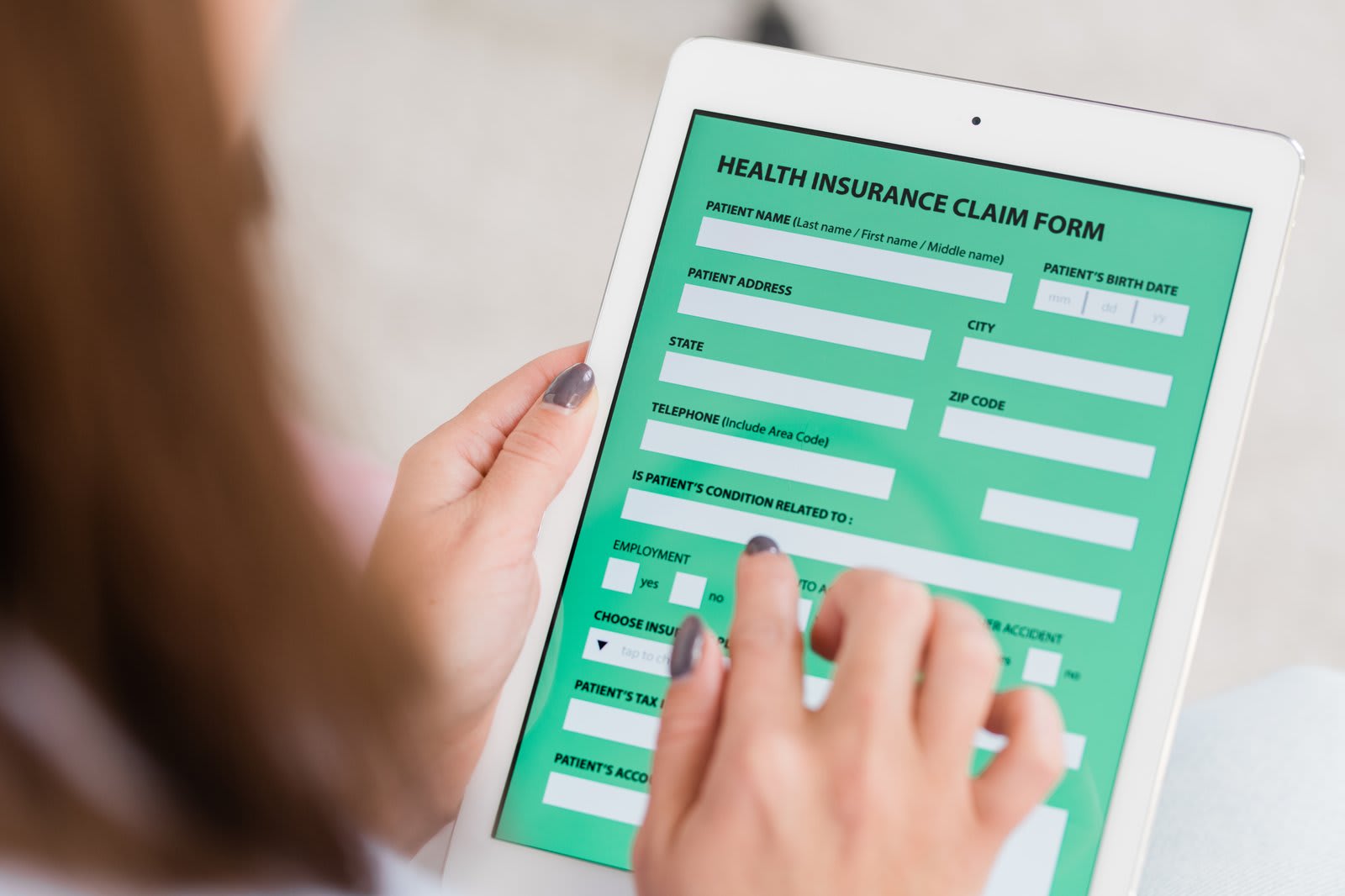 Health insurance claim form on a digital tablet